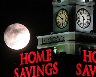 William D. Lewis the Vindicator A super moon rises over the Home Savings clock tower in downtown in Youngsotwn Monday Jan 1 2018. This super moon is known as the Wolf moon.