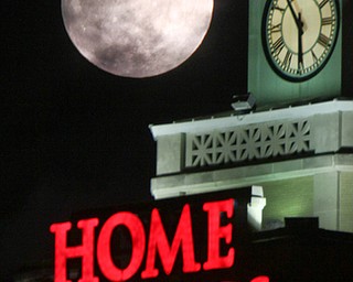 William D. Lewis the Vindicator A super moon rises over the Home Savings clock tower in downtown in Youngsotwn Monday Jan 1 2018. This super moon is known as the Wolf moon.