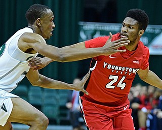 YOUNGSTOWN, OHIO - JANUARY 1, 2018: Youngstown State's Cameron Morse looks to pass while being guarded by Cleveland State's Bobby Word during the first half of their game on Saturday afternoon at the Wolstein Center. Youngstown State won 80-77. DAVID DERMER | THE VINDICATOR