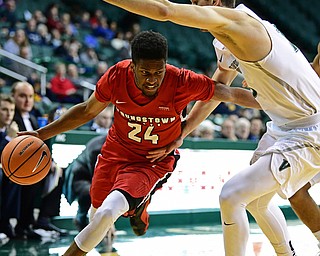 YOUNGSTOWN, OHIO - JANUARY 1, 2018: Youngstown State's Cameron Morse drives on Cleveland State's Stefan Kenic during the second half of their game on Saturday afternoon at the Wolstein Center. Youngstown State won 80-77. DAVID DERMER | THE VINDICATOR