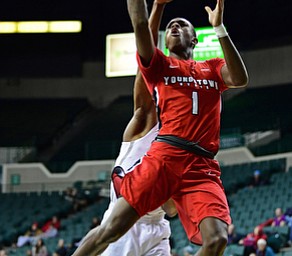 YOUNGSTOWN, OHIO - JANUARY 1, 2018: Youngstown State's Braun Hartfield goes to the basket against Cleveland State's Kenny Carpenter during the second half of their game on Saturday afternoon at the Wolstein Center. Youngstown State won 80-77. DAVID DERMER | THE VINDICATOR