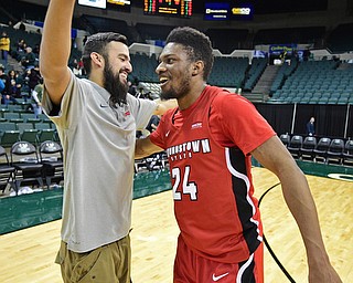 YOUNGSTOWN, OHIO - JANUARY 1, 2018: Youngstown State's Cameron Morse gets a hug from Francisco Santiago after he hit the game winning three point shot on Saturday afternoon at the Wolstein Center. Youngstown State won 80-77. DAVID DERMER | THE VINDICATOR