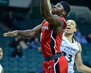 YOUNGSTOWN, OHIO - JANUARY 1, 2018: Youngstown State's Tyree Robinson goes to the basket against Cleveland State's Jamarcus Hairston during the first half of their game on Saturday afternoon at the Wolstein Center. Youngstown State won 80-77. DAVID DERMER | THE VINDICATOR