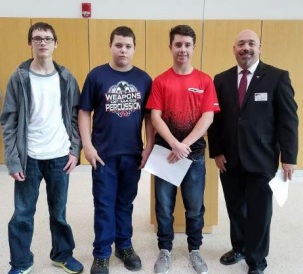 Austintown Fitch students recently attended Youngstown State University’s National Manufacturing Day and were awarded new equipment. Makaila Yuschak, 10th grade; and Jazalynn Lopez, 11th grade, took first-place honors and were awarded a desktop personal-use 3D printer and a 3D print of a coin bank. Above, from left, are Colin Smith, Robert Hoffman and Larry Iagullli, ninth-grade students who won second place and received a 3D printer pen for their design and 3D print of an iPhone cord organizer, and Dr. Darrell Wallace, associate professor of mechanical and industrial engineering at YSU. Below are Yuschak and Wallace.