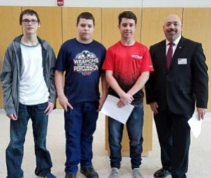Austintown Fitch students recently attended Youngstown State University’s National Manufacturing Day and were awarded new equipment. Makaila Yuschak, 10th grade; and Jazalynn Lopez, 11th grade, took first-place honors and were awarded a desktop personal-use 3D printer and a 3D print of a coin bank. Above, from left, are Colin Smith, Robert Hoffman and Larry Iagullli, ninth-grade students who won second place and received a 3D printer pen for their design and 3D print of an iPhone cord organizer, and Dr. Darrell Wallace, associate professor of mechanical and industrial engineering at YSU. Below are Yuschak and Wallace.