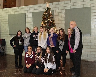 The Struthers Rotary hosted its annual Christmas party for special-needs children in December. The club serves more than 150 children throughout the county. This year, the club was assisted by members of Struthers Parkside Church, who served the meal, and members of Struthers High School Interact Club. Aut Mori clowns provided entertainment and Santa Claus made an appearance. Above are Rotary members and volunteers from the Interact Club caroling for the students, and below, Aut Mori clowns entertain.