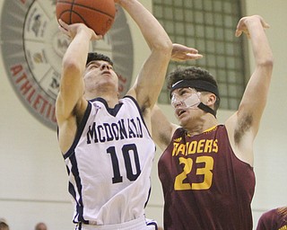 William D. Lewis the Vindicator McDonaldsJosh Celli(10) and South Range's Jason anderson(4)during 1-2-18 action at McDonald.