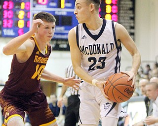 William D. Lewis the Vindicator McDonalds Rico Rodriguez(23) keeps the ball from South Range's Chris Brooks(10)during 1-2-18 action at McDonald.