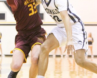 William D. Lewis the Vindicator McDonalds Matthew Beedle(32) and South Range's Brady White(33) during 1-2-18 action at McDonald.