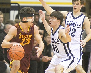 William D. Lewis the Vindicator McDonaldsJosh Celli(10) and RyanScala(22)  cover South Range's Jaxon Anderson(23) during 1-2-18 action at McDonald.