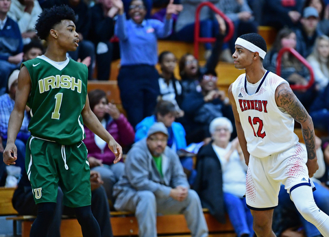 WARREN, OHIO - JANUARY 2, 2017: JFK's Byron James stares down Ursuline's Deshaun Harris after he hit a three point basket during the first half of their game on Tuesday night at Warren JFK High School. DAVID DERMER | THE VINDICATOR