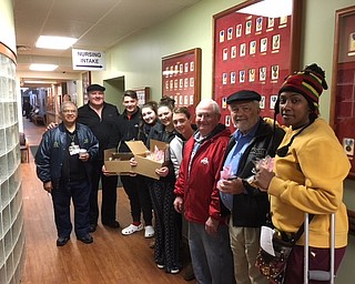 The Raybuck and Prout families of Canfield visited the Youngstown Veterans Administration Outpatient Clinic on 
Belmont Avenue on Dec. 27. They handed out homemade cookies and treats to the veterans receiving treatment.
