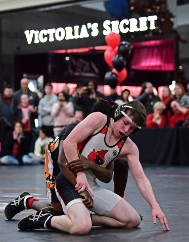 NILES, OHIO - JANUARY 3, 2018: Canfield's Chris Mauch attempts to break free from the control of Howland's Isaiah Lyles during their 120lb bout, Wednesday nigh at the Eastwood Mall. DAVID DERMER | THE VINDICATOR