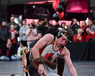 NILES, OHIO - JANUARY 3, 2018: Canfield's Chris Mauch attempts to break free from the control of Howland's Isaiah Lyles during their 120lb bout, Wednesday nigh at the Eastwood Mall. DAVID DERMER | THE VINDICATOR