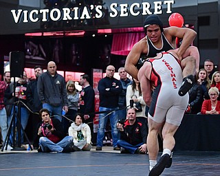 NILES, OHIO - JANUARY 3, 2018: Howland's Brandon Matlock fights to avoid being taken down by Canfield's Tyler Stein during their 220lb bout, Wednesday nigh at the Eastwood Mall. DAVID DERMER | THE VINDICATOR