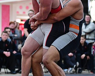 NILES, OHIO - JANUARY 3, 2018: Howland's Brandon Matlock attempts to pick up Canfield's Tyler Stein during their 220lb bout, Wednesday nigh at the Eastwood Mall. DAVID DERMER | THE VINDICATOR