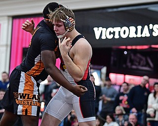 NILES, OHIO - JANUARY 3, 2018: Canfield's Dan Kapalko and Howland's Chris Julian grapple for position during their 285lb bout, Wednesday nigh at the Eastwood Mall. DAVID DERMER | THE VINDICATOR