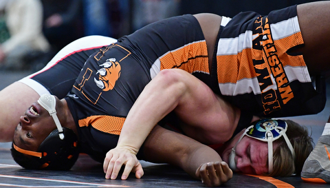 NILES, OHIO - JANUARY 3, 2018: Howland's Chris Julian attempts to keep his shoulders off the mat while Canfield's Dan Kapalko goes for the pin during their 285lb bout, Wednesday nigh at the Eastwood Mall. DAVID DERMER | THE VINDICATOR