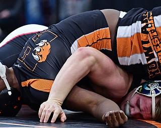 NILES, OHIO - JANUARY 3, 2018: Howland's Chris Julian attempts to keep his shoulders off the mat while Canfield's Dan Kapalko goes for the pin during their 285lb bout, Wednesday nigh at the Eastwood Mall. DAVID DERMER | THE VINDICATOR