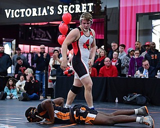 NILES, OHIO - JANUARY 3, 2018: Canfield's Dan Kapalko stares down Howland's Chris Julian after pinning him to end their 285lb bout, Wednesday nigh at the Eastwood Mall. DAVID DERMER | THE VINDICATOR