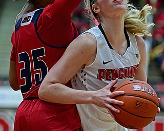 YOUNGSTOWN, OHIO - JANUARY 4, 2017: Youngstown State's Sarah Cash goes to the basket against Illinois-Chicago's Tylah Lampley during the second half of their game, Thursday night at Beeghly Center. 76-63. DAVID DERMER | THE VINDICATOR