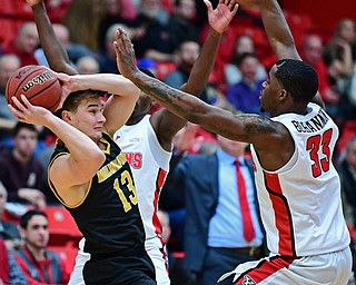 YOUNGSTOWN, OHIO - JANUARY 4, 2017: Milwaukee's August Has looks to pass the ball to a teammate while being pressured by Youngstown State's Naz Bohannon and Garrett Covington during the first half of their game, Thursday night at Beeghly Center. DAVID DERMER | THE VINDICATOR