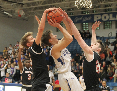 Poland's Mike Diaz (2) gets blocked while going up for a shot by Jake Ryan (5) and Ryan Leonard (20) during the first half of Thursday nights matchup at Poland High School.   Dustin Livesay  |  The Vindicator  1/4/18  Poland.