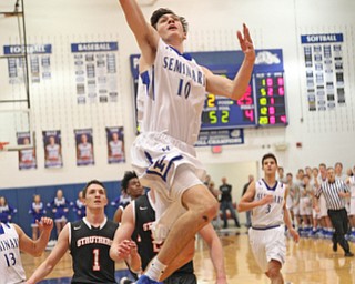 Poland's Daniel Kramer (10) goes up for a dunk during the first half of Thursday nights matchup against Struthers at Poland High School.   Dustin Livesay  |  The Vindicator  1/4/18  Poland.