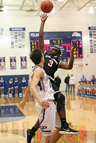 Kevin Taylor (3) of Struthers puts up an unbalanced shot while being defended by Daniel Kramer (10) during the second half of Thursday nights matchup at Poland High School.   Dustin Livesay  |  The Vindicator  1/4/18  Poland.