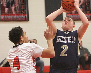 William D Lewis the vindicator  Brookfield'sNate Smoot(2) shoots past Girard's David Blackmon(4) during 1-5-18 action at Girard