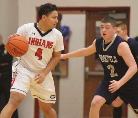 William D Lewis the vindicator  Brookfield'sNate Smoot(2) gaurds Girard's David Blackmon(4) during 1-5-18 action at Girard