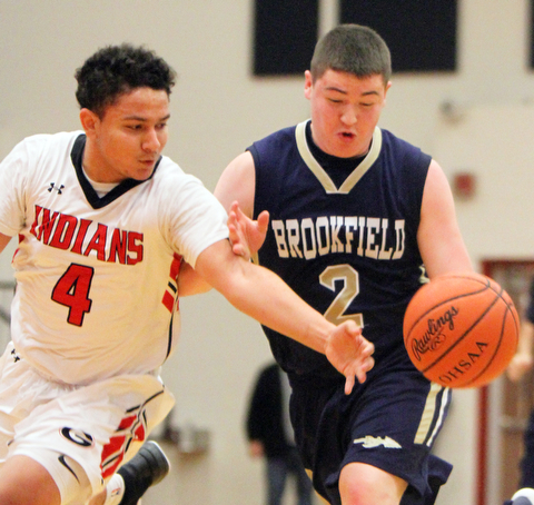 William D Lewis the vindicator  Brookfield'sNate Smoot(2) drives around Girard's David Blackmon(4) during 1-5-18 action at Girard