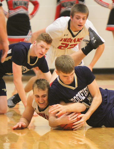 William D Lewis the vindicator  Girard'sMark Waid(15) and Brookfield's Brady Reichart(14) fight for the ball as Brookfield's Conner Stevens(1) and Girard's Christian Graziano(22) look on during 1-5-18 action at Girard.
