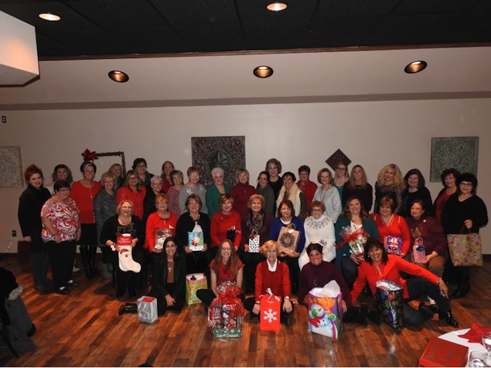 The GFWC Ohio Austintown Junior Women’s League recently hosted its annual Christmas dinner at Tavola’s in Austintown. Members enjoyed a buffet and made plans for a fundraiser, “A Taste of Austintown,” that will take place March 1. A collection was taken to purchase gift cards for several needy families in the Austintown area. For information about AJWL visit www.austintownjuniorwomensleague.org. Seated on the floor, from left, are Brittany Bueno, Jessica Munger, Kathy Mock, Janet Polish and Ruty Rodriguez-Patterson. Seated are Colleen Miller, Janie Surman, Marcia Denamen, Marie Dockry, Paulette Dockry, Sue Hovanec, Shirley Schmidt, April McGahagan, Eileen Frost and Karma Minkewicz. Standing are Judy Rodkey, Jennifer Bodnar, Tiffany Shaffer, Genevieve Bodnar, Nancy Jones, Eileen Lozier, Chrissy Bloom, Dawn Blinsky, Sandy Gaskill, Evie Moore, Janice Simmerman, Donna Wear, Linda Jones, MaryAnn Herschel, Shari Beelen, Joann Sulenski, Maribeth McGlynn, Lynn Larson, Lauren Wolfgang, Stephanie Oyster, Cynthia Ciriaco, Peggy Bennett, Mary Kay Erickson and Ellen Kosa.