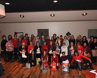 The GFWC Ohio Austintown Junior Women’s League recently hosted its annual Christmas dinner at Tavola’s in Austintown. Members enjoyed a buffet and made plans for a fundraiser, “A Taste of Austintown,” that will take place March 1. A collection was taken to purchase gift cards for several needy families in the Austintown area. For information about AJWL visit www.austintownjuniorwomensleague.org. Seated on the floor, from left, are Brittany Bueno, Jessica Munger, Kathy Mock, Janet Polish and Ruty Rodriguez-Patterson. Seated are Colleen Miller, Janie Surman, Marcia Denamen, Marie Dockry, Paulette Dockry, Sue Hovanec, Shirley Schmidt, April McGahagan, Eileen Frost and Karma Minkewicz. Standing are Judy Rodkey, Jennifer Bodnar, Tiffany Shaffer, Genevieve Bodnar, Nancy Jones, Eileen Lozier, Chrissy Bloom, Dawn Blinsky, Sandy Gaskill, Evie Moore, Janice Simmerman, Donna Wear, Linda Jones, MaryAnn Herschel, Shari Beelen, Joann Sulenski, Maribeth McGlynn, Lynn Larson, Lauren Wolfgang, Stephanie Oyster, Cynthia Ciriaco, Peggy Bennett, Mary Kay Erickson and Ellen Kosa.