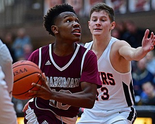 HOWLAND, OHIO - JANUARY 5, 2018: Boardman's Derrick Anderson goes to the basket against Howland's Connor Tamarkin during the first half of their game, Friday night at Howland HigH School. DAVID DERMER | THE VINDICATOR