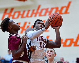 HOWLAND, OHIO - JANUARY 5, 2018: Howland's Samari Dean goes to the basket against Boardman's Derrick Anderson during the first half of their game, Friday night at Howland HigH School. DAVID DERMER | THE VINDICATOR