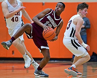 HOWLAND, OHIO - JANUARY 5, 2018: Boardman's Che Trevena looks down court to pass after leaping to secure a pass away from Howland's Connor Tomarkin during the second half of their game, Friday night at Howland HigH School. DAVID DERMER | THE VINDICATOR