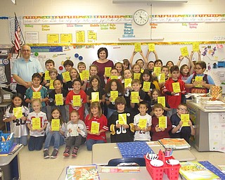 The Struthers Rotary Club has participated in the Dictionary Project since 2003. The Rotary provides dictionaries to students in the third grade in local schools. The goal is to assist students in becoming good writers, active readers, creative thinkers, and resourceful learners by providing them with their own personal dictionary that may be used for many years. Pictured above are Rotarians Jennifer Johnson, club president; and Tom Baringer, with the third-grade students at Lowellville. Below are some of the students from Campbell, with Baringer and Johnson.
