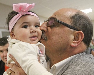 William D. Lewis the Vindicator  Zl Adi kisses Sophia Niser, 5 months during a vicotry party at the Arab American Community Center after winning a stay of deportation. Sophia is a daughter of Amal and Nedal Niser of Liberty.