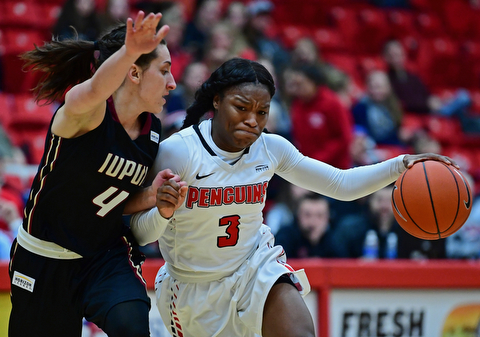 YOUNGSTOWN, OHIO - JANUARY 6, 2017: Youngstown State's Indiya Benjamin drives on IUPUI's Holly Hoppingarner during the second half of their game, Saturday afternoon at Beeghly Center. IUPUI won 65-43. DAVID DERMER | THE VINDICATOR