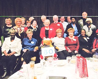 East High School classmates gathered for their 60th class reunion in December at Johnny’s Restaurant in Boardman. In front, from left, are Jeanne Cernock Mahon, Cleo Mosley, Bertha Bandi Hill, East High Golden Bear, Carmel Canacci Baughman, Roseann Gaudio Ferraro, Catherine Perkins Coleman and Jewell Boswell Hudson. In row two are Carol Thomas Crann, Patricia Petretic Hannis, Marian Cacivilano Jordan, Marlene Desiato DePietro, Larry Fauver, Ann Jackson and Lorraine Curry Thomas. In back are Dorothy Rogers Shaw, Sandra DelPlato Shellito, Judy Adams Kosek, Marie Rago Karas, Geraldine Guerrieri Kurian, Joseph Haas, Sam Fisher, Lewis Galante and Robert Demechko. Al Zarbaugh also attended the event.