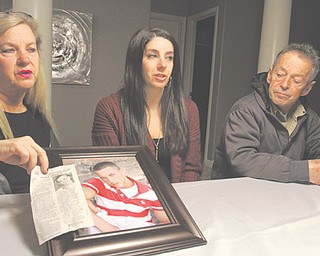 After Johnson died of an overdose at 27, his mother, Cheryl Puskas, left; sister, Courtney (Puskas) Worley; and father, Gus Johnson III, spoke out about Jordan’s struggle with addiction. His mother is holding his portrait and his obituary, in which she shared the story of his struggle in the hope it will help other families.
