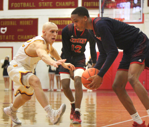 William D. Lewis The Vindicator JFK's Tyler James(5) keeps the ball from Mooney's Jonnie Mikos(32)