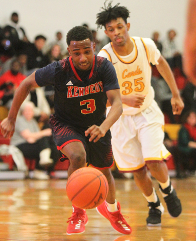 William D. Lewis The VindicatorJFK's Terrance King(3) and Mooney'sJordan Standford (35) pursue the ball.