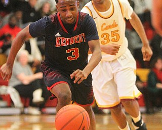 William D. Lewis The VindicatorJFK's Terrance King(3) and Mooney'sJordan Standford (35) pursue the ball.