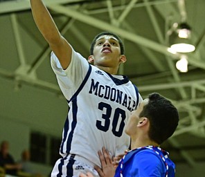 McDONALD, OHIO - JANUARY 9, 2018: McDonald's Braedon Poole goes to the basket against Western Reserve's Dom Velasquez during the second half of their game, Tuesday night at McDonald High School. DAVID DERMER | THE VINDICATOR