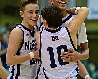 McDONALD, OHIO - JANUARY 9, 2018: McDonald's Braedon Poole is congratulated by Rico Rodriguez and Josh Celli after scoring his 1000th career point during the second half of their game, Tuesday night at McDonald High School. DAVID DERMER | THE VINDICATOR