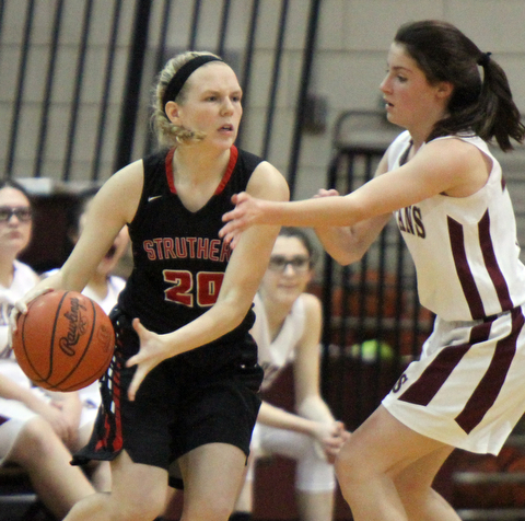 William D. Lewis  The Vindicator  BStruthers' Renee Leonard(20) dribbles around Reagan Burkey(15) of Boardman) during 1-10-18 action at Boardman