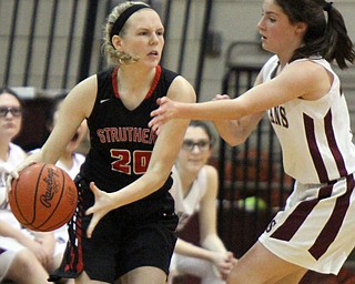 William D. Lewis  The Vindicator  BStruthers' Renee Leonard(20) dribbles around Reagan Burkey(15) of Boardman) during 1-10-18 action at Boardman
